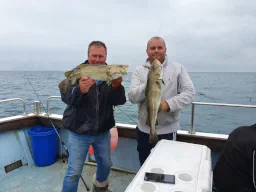 Two Anglers Each holding a Codling